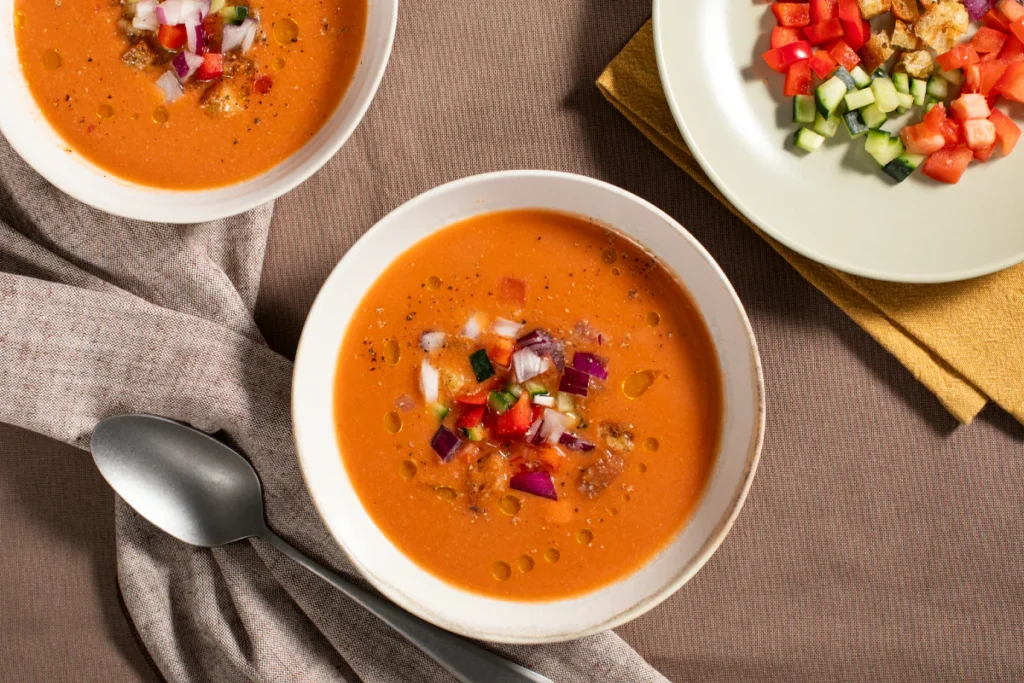 A cold tomato-based soup from Andalusia blended with cucumbers, peppers, onions, and garlic. Refreshing and perfect for summer.
