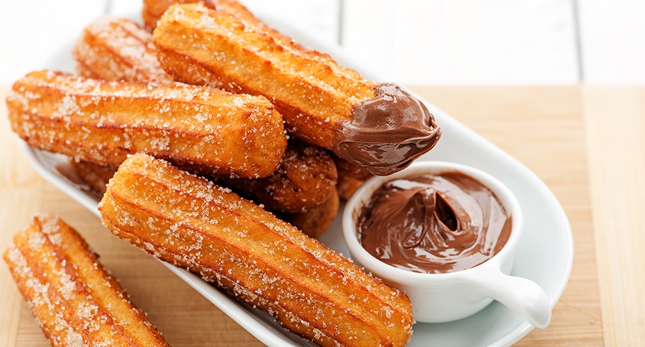 Churros are long, ridged sticks of fried dough,
